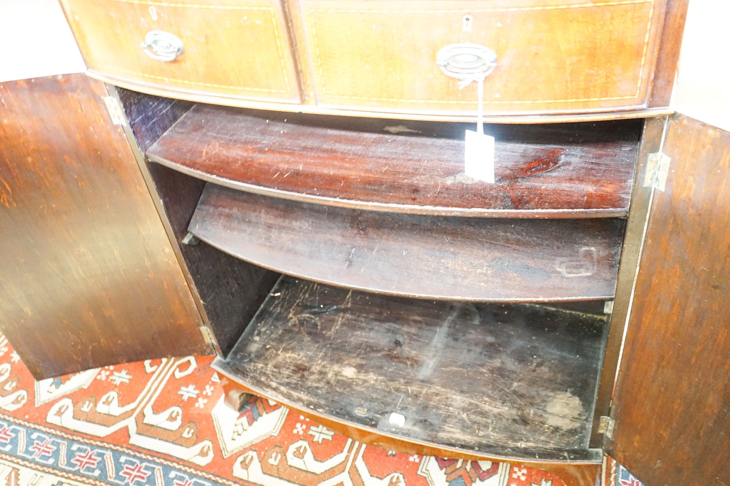 An Edwardian mahogany bowfront side cabinet, width 92cm, depth 47cm, height 113cm